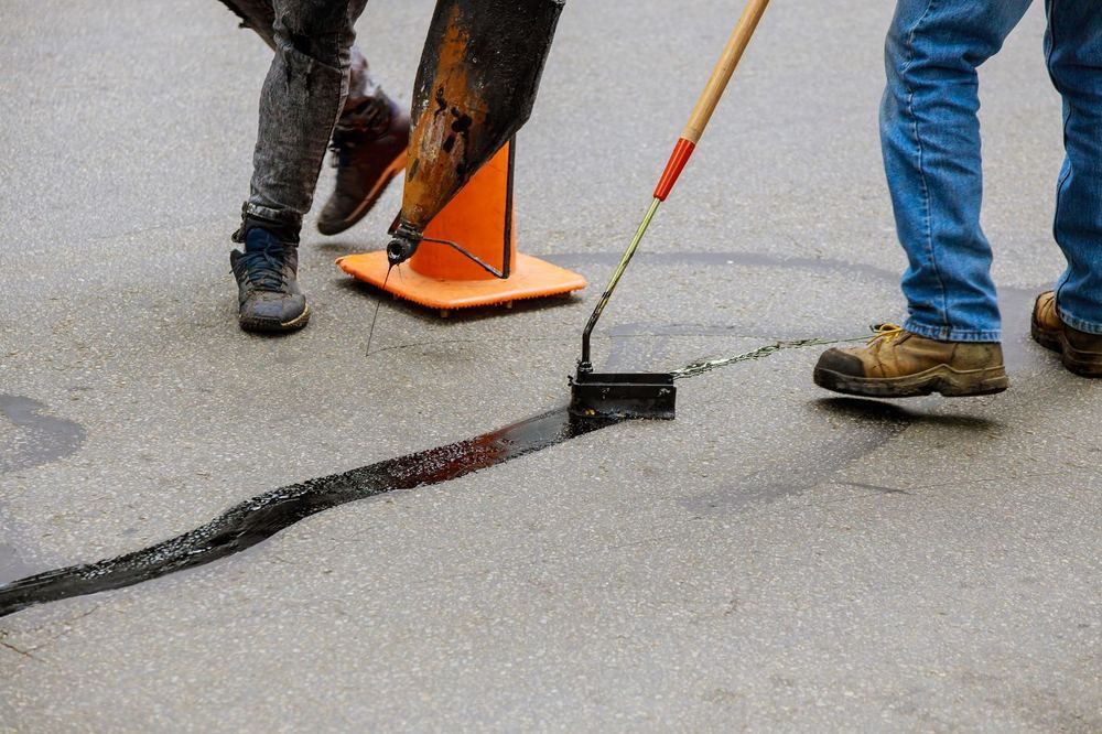 Crew crack sealing a lot
